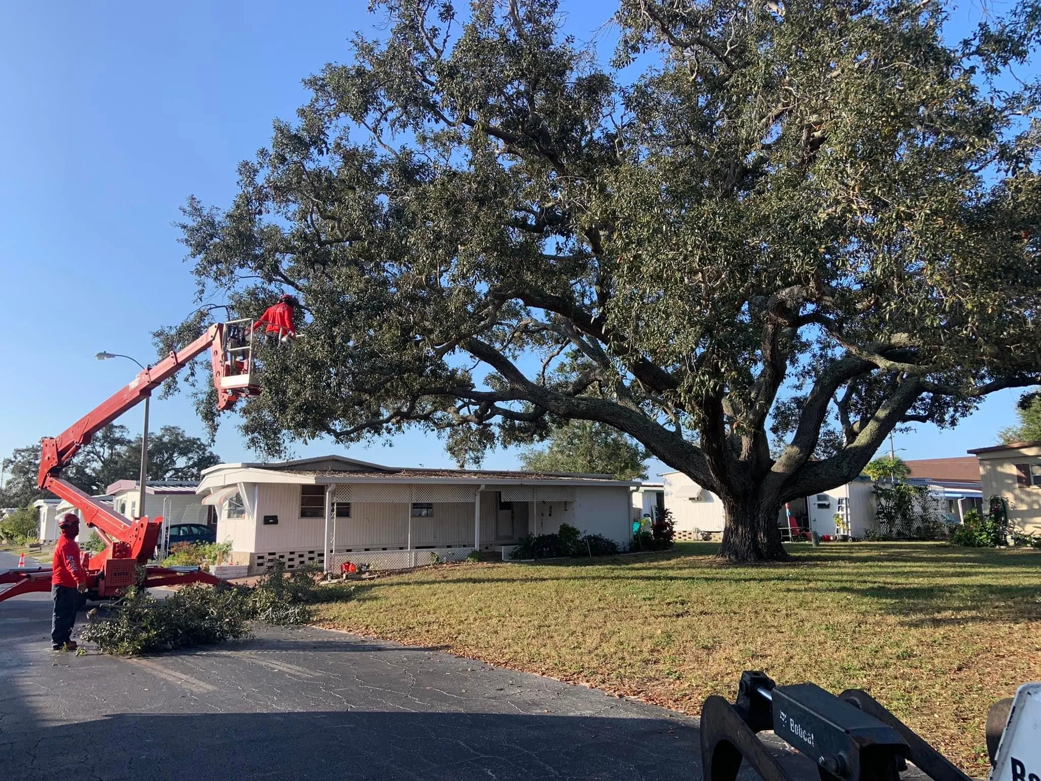 Crane lifting rigged sections safely near structures